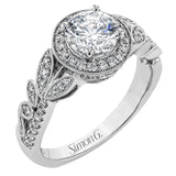 The stunning nature-inspired design of this white gold engagement ring features lovely milgrain edging and a total of .34 ctw of round white diamond accents.