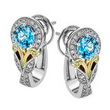 These glamorous two-tone gold earrings feature a stunning 2.07 ctw of blue zircon centerpieces against .30 ctw of white diamond halos and accents