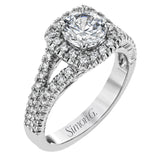 This elegant, contemporary design in white gold sparkles with .45 ctw of round white diamonds in its halo and split shank.