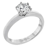 This beautifully simple design in white gold is the perfect setting to let a single round stone shine.
