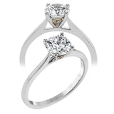 The clean lines of this white gold ring perfectly frame a single round stone as a centerpiece.