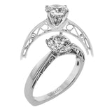 This sleek, elegant white gold ring features delicate filigree detailing to accentuate its single, central stone.
