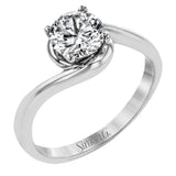 This beautiful contemporary design in white gold combines simplicity and a gracefully curved shank to accentuate a single, central stone.