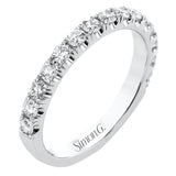 This classic wedding band features a distinctive setting style that shows off the .50 ctw of white diamonds to their full advantage.