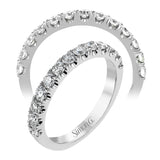This wedding band has a beautiful timeless design which will be in style for years. The ring contains .77 ctw of white diamonds.