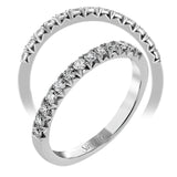 This delicate band contains .36 ctw of white diamonds which are specially set to showcase their sparkle.
