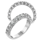 This classic wedding band features a distinctive setting style that shows off the .97 ctw of white diamonds to their full advantage.