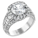 This show-stopping halo design contains .88 ctw of round diamonds along with a whopping 1.03 ctw of baguette cut diamonds.