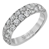 Simple yet elegant, this understated white gold band sparkles with 1.57 ctw of round white diamonds
