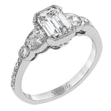 This lovely contemporary design features white gold and .16 ctw of round white diamonds and .39 ctw of oval shaped white diamonds as well as delicate milgrain edging around its centerpiece.
