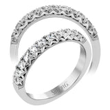 This classic wedding band features a distinctive setting style that shows off the .50 ctw of white diamonds to their full advantage.