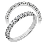 This band pairs perfectly with an engagement ring, or can be worn on its own or stacked with other rings. It contains .50 ctw of white diamonds.