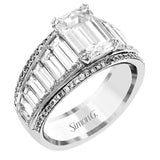 Modern and geometric, this two-tone 18k white and rose gold ring contains 2.12 ctw of white baguette diamonds as well as .20 ctw of pink diamonds.