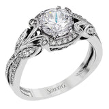 This amazing 18k white gold engagement ring features vintage-inspired design elements set with .28 ctw of white diamonds.