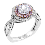 This lovely halo engagement ring is crafted in tones of 18k rose and white gold and contains .36 ctw of white diamonds along with .18 ctw of pink diamonds.