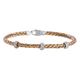 This wonderful bracelet is woven from pure 18k rose gold, with a rich warmth which sets off the .33 ctw of white diamonds in its midst. Perfect for stacking.
