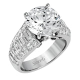 Crafted from 18k white gold, this modern engagement ring commends attention with 1.34 ctw of princess cut diamonds in combination with 1.42 ctw of baguette diamonds.