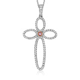 This open, modern take on a cross pendant is rendered in 18k white and rose gold and set with a .03 ct pink diamond and .35 ctw of white diamonds.