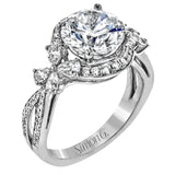 Dramatic yet romantic, this exquisite white gold engagement ring features .61 ctw of round cut white diamonds highlighted by .58 ctw of pear shaped diamonds in delicate floral motifs.