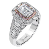 This lovely 18k white and rose gold ring has a graduated design which leads up to a rectangular center stone setting. The ring contains .18 ctw of round diamonds, .07 ctw of pink diamonds, and 1.48 ctw of baguette diamonds.