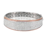 This Simon Set bracelet is the ultimate luxury statement with an astounding 13.64 ctw of white princess cut diamonds in its midst, accented by edges of .75 ctw of pink diamonds in rose gold.