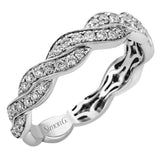 Featuring a dynamic two-tone twist design, this yellow and white gold contemporary ring is set with .53 ctw of round cut white diamonds.