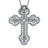 Set with a shimmering center diamond, this Gothic style cross pendant features 1.43 ctw of sparkling white diamonds through its stunning design.