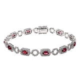 This elegant diamond and gemstone bracelet features 2.21 ctw of ruby and 1.90 ctw of white diamonds, set in 18K white gold