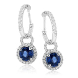 These gorgeous white gold earrings feature 1.41 ctw of sapphires highlighted by .44 ctw of round white diamond accents.