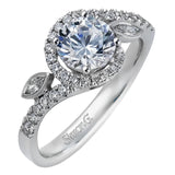 The charming floral design of this contemporary white gold ring is enhanced by .28 ctw of round cut white diamonds and .07 ctw of marquise cut white diamonds.