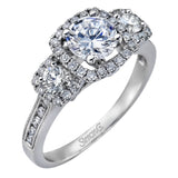 This dramatic contemporary white gold ring is accentuated by .37 ctw round cut white diamonds and features .30 ctw glimmering side stones.