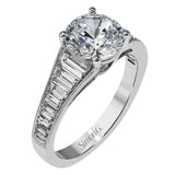 Baguette diamonds increasing in size lead the way to the center of this gorgeous engagement ring design. The outside edge is decorated with delicate milgrain, and this ring contains .98 ctw of side diamonds.