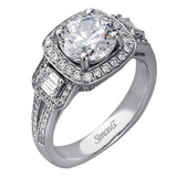 The dazzling contemporary design of this white gold engagement ring is emphasized by .44 ctw round cut white diamonds and .45 ctw emerald cut white diamonds.