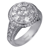 This spectacular ring features a Simon Set center feature with 1.85 ctw of custom-cut diamonds that fit perfectly together. The rest of the ring contains .72 ctw of round diamonds.