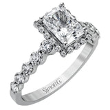 Featuring a delicate contemporary design, this brilliant white gold engagement ring is highlighted by .64 ctw of round cut white diamonds in an eye-catching geometric setting.