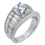 This eye-catching contemporary white gold engagement ring is accented by .75 ctw round cut white diamonds and 1.26 ctw baguette white diamonds for an unforgettable look.