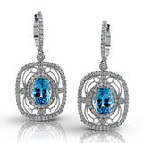 Featuring delicate vintage-inspired styling, these beautiful earrings are set with 1.00 ctw of round cut white diamonds and 2.21 ctw of lovely aquamarines.