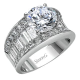 Dramatic and bold, this white gold contemporary engagement ring is accented by 1.87 ctw princess cut white diamonds and 1.67 ctw glistening baguette white diamonds.