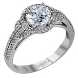 This 18k white gold ring contains .30 ctw of side diamonds set within its classic halo design.