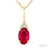 1/50 Ctw Oval Cut 6X4 MM Ruby and Round Cut Diamond Precious Pendant With Chain in 10K Yellow Gold