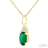1/50 Ctw Oval Cut 6X4 MM Emerald and Round Cut Diamond Precious Pendant With Chain in 10K Yellow Gold
