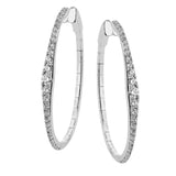 A fresh take on the diamond hoops in 18K white gold 1.11 ctw, they taper at the ends and feature larger diamonds in the center graduating to small towards the ends.