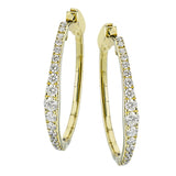 Dress up your classic button down with these 18K yellow gold hoops featuring .97cttw diamonds.
