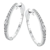 Dress up your classic button down with these 18K white gold hoops featuring .97cttw diamonds.