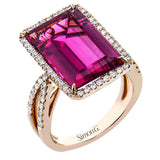 A modern marvel.  This 18k rose gold ring features 8.10ct rubelite surrounded by .58cttw diamonds.