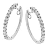 These beautiful diamond hoops are set in white gold, and have a prong set design with .70 ctw of diamonds