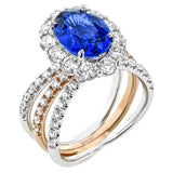 18K white and rose gold split shank ring with an oval sapphire 3.4 ct. center, and 1.81 ctw. of diamonds in the halo and on the bands