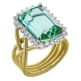 18k right hand ring has a twisted yelow gold coil shank, and features a stunning an emerald cut Green Tourmaline 9.90 ctw. with a halo of white diamonds 0.77 ctw.