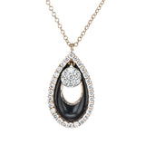 Diamond, enamel, and 18k gold combine in this modern pendant to create a distinctive look.
