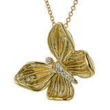 A shining golden butterfly sparkles with .06 ctw of white diamonds in this wonderful 18k gold pendant.
